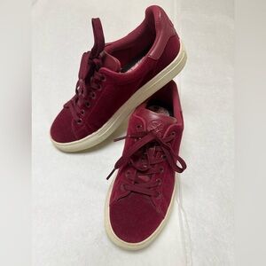 G/FORE Disruptor golf shoes in a red or burgundy suede color. 🌹